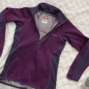 Athletic 1/2 zipper pullover top with small zipper pocket. Never been worn